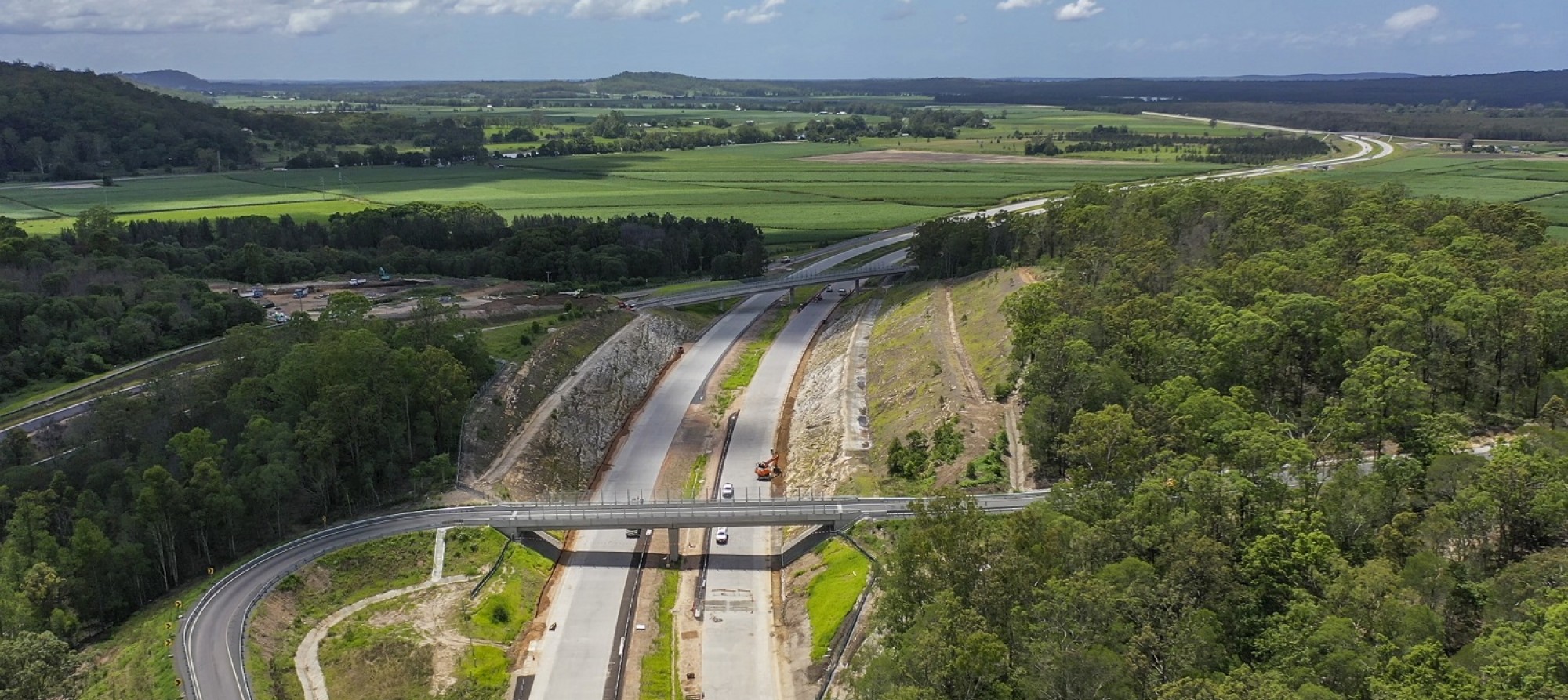 Aerial view of new highway with two overpass bridges 